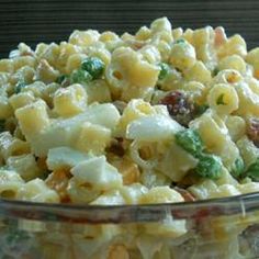 a glass bowl filled with macaroni and cheese