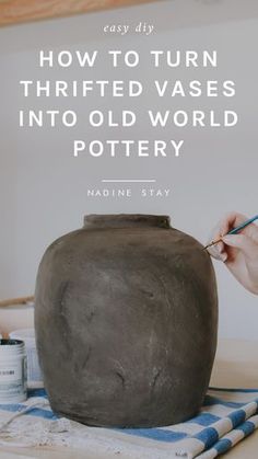 someone is painting a pottery pot with the words how to turn thrifted vases into old world pottery