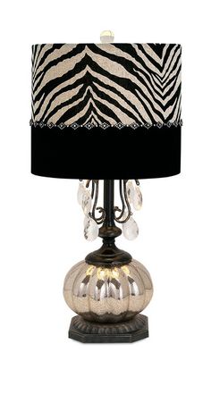 a lamp with a zebra print shade on it