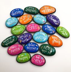 colorful painted rocks with words on them