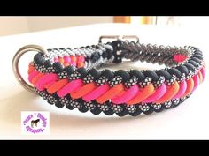 a pink and black bracelet with silver clasp