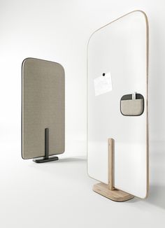 a mirror with a wooden stand next to it and an empty tag on the door