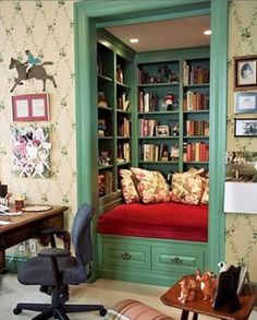 a room with a desk, chair and bookshelf filled with lots of books