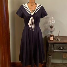 Navy Blue Sailor Collectif Dress. Collar Is Removable, With A Back Zip. Two Hip Deep Pockets. Size Small. Chest 17” Waist 13.5” Hips 26.5” Length 52.5” New With Tag. Purchased In Whitby, England. 98% Cotton 2% Elastane. Machine Wash. Sailor Inspired Outfit, Marine Dress Blues Uniform, Sailor Dress Women, Marines Dress Blues, Whitby England, Sailor Blouse, Navy Blue Dress Casual, 1950's Dress, 2024 Wishlist