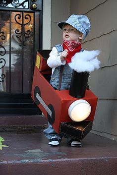 a young boy dressed up as thomas the train