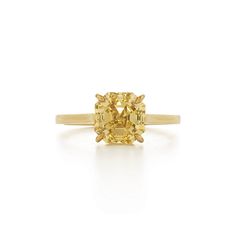 a yellow diamond ring on a white background