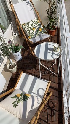 two lawn chairs sitting next to each other on top of a brick floor covered in potted plants