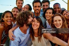 a group of people taking a selfie together