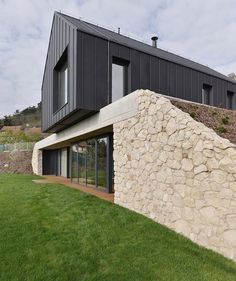 the house is built on top of a rock wall