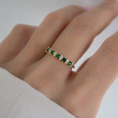 Beautifully crafted emerald ring is a true stunner! Looks great stacked or on its own! - - - D E T A I L S - - - * Made of 925 Sterling Silver * We use a THICK plating of 14k Gold or Rhodium * Available in sizes 4-10 * Nickel-free & Hypoallergenic - Will not turn your fingers green! * Made of the highest grade cubic zirconia for an authentic look! * Also available in Turquoise or Opal! If you're unsure of your ring size, we recommend trying our ring size tool! https://www.etsy.com/listing/124090 Emerald And Silver Ring, Emerald Ring Stack, Emerald Ring Band, Green Wedding Band, Green Wedding Ring, Green Gold Ring, Gold Ring With Emerald, Emerald Green Ring, Emerald Ring Design