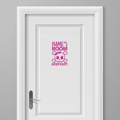 a door with the name's room on it and a pink skull in the center