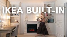 a woman standing in front of a fireplace with the words ikea built - in