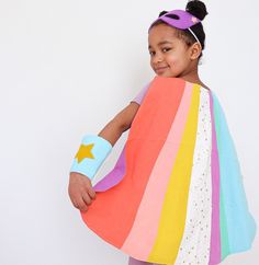 "Superhero Cape | Organic Superhero Cape | Gifts for Kids | Personalized Superhero Cape Every kid is a superhero! Let their imagination soar and take them anywhere they want to go with our new superhero sets. ⚡️ These capes are exceptionally unique, just like your child. Much care was taken to design the capes to be unlike any others available, and to embrace originality and fun! Mask: Purple felt with peach stars Cuffs: Light blue with yellow felt stars It's Earth Friendly! This cape is made pr Rainbow Superhero, Diy Superhero Costume, Super Hero Capes For Kids, Super Hero Cape, Felt Stars, Girls Cape, Costume Capes, Superhero Cape