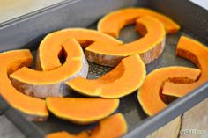 some cut up pumpkins sitting in a pan