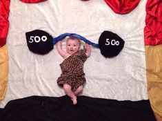 a baby is laying down on a bed with the number 500 written in front of it