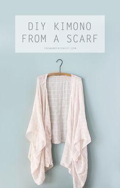 a cardigan hanging on a wall with the words diy kimono from a scarf above it