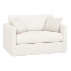 a white couch with two pillows on it's back and the seat upholstered