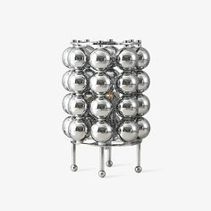 a large metal rack with balls on it's sides and four legs that are attached to each other