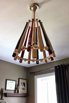 a chandelier made out of baseball bats