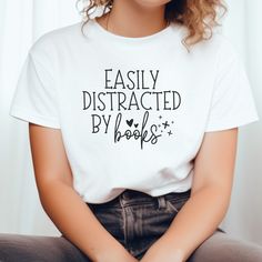 Easily distracted by books tee, Bookworm Gift idea, For Book lovers, reader tshirt, Cool Librarian, Nerdy, Teacher Profession, Reading Hobby Reading Tshirt Ideas, Bookworm Tshirts, Reading Hobby, Reading Tshirt, Book Shirt, Funny Coffee Cups, Tshirt Ideas, Easily Distracted, Gifts For Bookworms