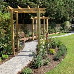 a garden with wooden arbors and benches