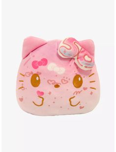 a pink hello kitty coin purse with a bow on the front and an embellishment