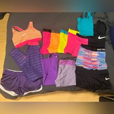 Lightly Worn, Great Quality Workout Clothing. Mostly Nike. 6 Pairs Of Nike Pro Shorts And A Pair Of Nike Pro Leggings. A Sports Bra. 3 Tanks. 3 Other Pairs Of Shorts. Most Are Size M. A Few Smalls And Larges. An Awesome Bundle, Some Pieces Have Never Been Worn Nike Fitted Sports Sets, Nike Fitted Sportswear Sets, Fitted Nike Sports Sets, Nike Pro Leggings, Nike Pro Shorts, Nike Workout, Workout Clothing, Shorts Nike, Nike Pink