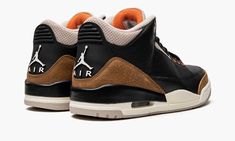 the nike air jordan iv is shown in black, brown and white with an orange sole