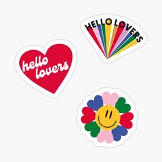 three stickers with the words hello loves and a smiley face on them, all in different colors