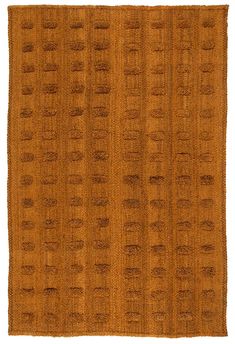 a brown rug with small circles on it