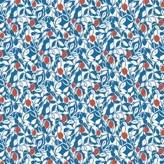 a blue and white pattern with red berries on it