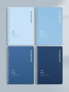 three spiral bound notebooks with blue covers