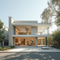 a large white house sitting on the side of a road