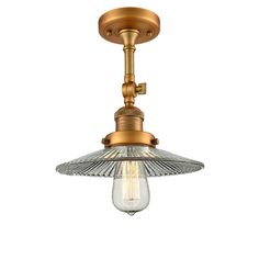 an antique brass ceiling light with glass shade