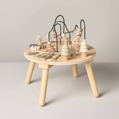 a wooden table topped with toys on top of it