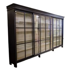 a bookcase with glass doors and shelves on each side, against a white background