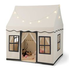 a toy house with lights on the roof