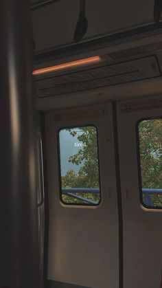 two windows on the inside of a train