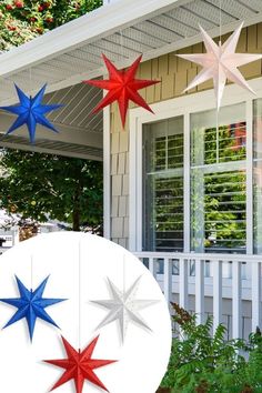 red, white and blue stars hanging from a porch