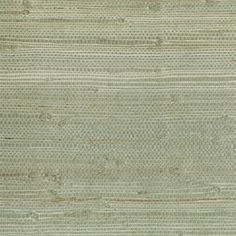 an area rug that is made up of different shades of green and beiges, with horizontal stripes