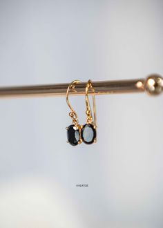 These 18k gold Black Onyx Dangle Earrings are the perfect size - noticeable yet comfortable to wear all day. They're not too big or too small - just right! If gold isn't your thing, they also come in sterling silver and rose gold. Sold as a pair, they come with silicone ear backs to ensure they stay secure all day long. DETAILS * Length - 22mm * Materials - 18k gold thick gold vermeil over 925 sterling silver, natural genuine black onyx stone * Nickel free * Sold as pair * Ships from Houston, TX * Packaged carefully in our custom gift ready jewelry box SHIPPING * Additional shipping upgrades via UPS or FedEx are also available here https://www.etsy.com/shop/VEATGE?section_id=28699742 * Processing time - 2 business days, usually ships the next day. We are closed on Saturdays and Sundays, or Black Gold-plated Earrings For Gift, Black Gold-plated Drop Earrings, Black Tarnish Resistant Dangle Jewelry, Tarnish Resistant Black Dangle Jewelry, Black 14k Gold Single Earring, 14k Gold Single Black Earring, Black Stone Earrings, Black Onyx Jewelry, Black Diamond Earrings