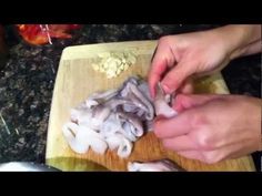 someone is chopping mushrooms on a cutting board