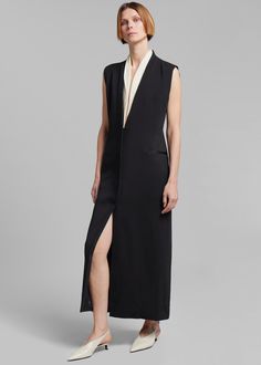 Color: Black Midweight woven fabric Regular fit Maxi length Deep v neckline Contrast collar Lightly padded shoulders Sleeveless Front illusion welt pockets Front slit Concealed front button closure Lined 93% Viscose 7% Elastane Dry Clean By Esse Studios. Imported Esse Studios, Paris Store, Denim Suit, Frankie Shop, Ny City, Paris Woman, Contrast Collar, Leather Texture, Unisex Gifts