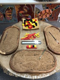 a table topped with lots of different types of crafting supplies on top of it