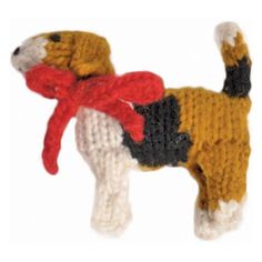 a knitted dog ornament with a red scarf on it's neck