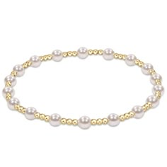 You will fall in love with this classic sincerity pattern 4mm bead bracelet! This bracelet is a classic gold beaded bracelet with alternating pearl beads. The larger bead size is a 4mm and the smaller bead size is a 2mm. Made with 4mm and 2mm, 14kt gold-filled beads Worry-free wear‚ which means sleep, shower and sweat in it Hand beaded on high performance elastic for a slight stretch to easily roll on and off your wrist Measures 6.25" Stacks well with all bracelets Gold Beaded Bracelet, Gold Bead Bracelets, Trendy Boho, Classic Gold, Crystal Pearls, Roll On, Gold Pearl, Bracelet Stack, Hand Beading