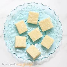 four pieces of cheese on a glass plate