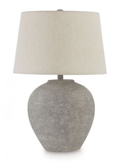 a gray table lamp with a white shade