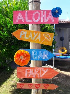 a wooden sign that says aloha, playa bar and party on it