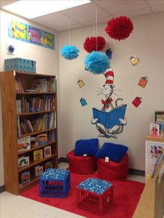 the cat in the hat themed classroom is decorated with red, white and blue pom poms